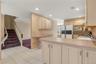 Kitchen featuring wood-finish cabinetry, integrated oven, and a built-in microwave