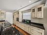 The tall cabinets have window lights and interior lighitng.