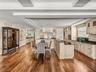 Facing east, this is the view of the kitchen. There is certainly no shortage of drawers and cabinets!