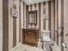 The half-bath, located off of the hallway, is convenient to the main living area