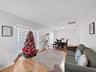 living room w bay window and dining room