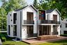 Modern rear exterior highlighting spacious decks, private balconies, and tranquil wooded surroundings.