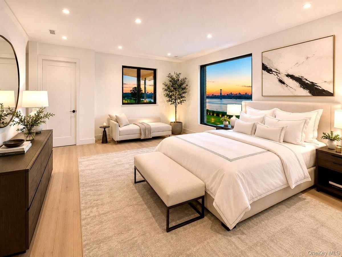 Virtually StagedViews of the Saddle Rock Waterfront and the bridge are visible from the Primary Bedroom.