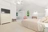 Dramatic oversized bedroom with cathedral ceiling on the first floor