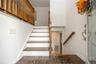 Tiled entry with oak banisters