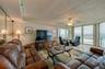 The living area features full-length windows with unobstructed ocean views and access to the balcony an ideal setting for relaxing or hosting guests.