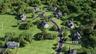 Residential development featuring a winding street and multiple homesites