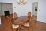Spacious dining room with door the kitchen
