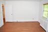 Primary bedroom with hardwood floors