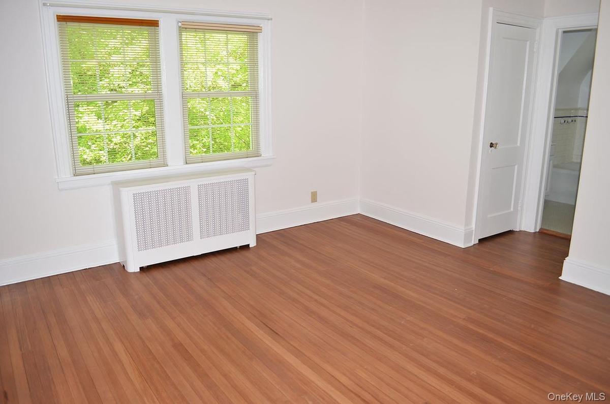 Spacious primary bedroom with two closets and full bath