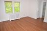 Spacious primary bedroom with two closets and full bath