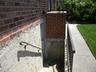 stairway/egressBrick exterior with stucco foundation