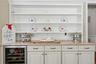 Kitchen w Built In Cabinetry and Wine Fridge