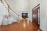 Large Foyer w Wood Floors Throughout