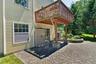Patio at lower level with view of deck above.. ALL beautiful pavers