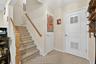 Stairs to lower level and storage area