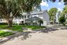 Extensive Parking Pad & Side Load Garage