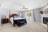 Primary Bedroom with Fireplace and Private Balcony