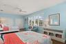 Light and bright room with large windows with plantation shutters.