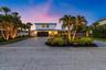 Professionally landscaped with upgraded lighting, and irrigation is connected to a well.