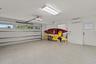 Large 2 car garage with mini-split AC, hurricane rated garage door installed in 2023, epoxy floor coating and separate storage room  (behind kayaks in