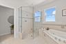 Primary bathroom with separate tub and shower, as well as a water closet with bidet.
