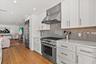 Commercial grade appliances including SubZero refrigerator and 6 burner Thermadore range.