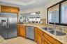 Cucina Features an Interior Ambiance Custom Cabinetry, Granite Surfaces, Bar Height Peninsula,Frigidaire Professional Series Stainless Appliances, Pol
