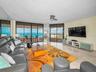 Spacious Light & Bright Great Room Floor to Ceiling Sweeping Aquamarine Seascapes.  Hurricane Shutters for Added Peace of Mind.