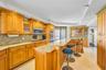 Cucina Features an Interior Ambiance Custom Cabinetry, Granite Surfaces, Bar Height Peninsula,Frigidaire Professional Series Stainless Appliances, Pol