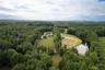 Aerial view of a forest and a nearby body of water