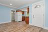 1 BR apartment entry, living area and kitchen