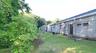 A view of the back of the building..  This area is mowed regularly.