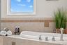 Large jetted soaking tub.