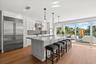 Huge kitchen island that accommodates 9 barstools