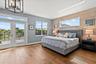 Massive primary bedroom on the second floor with private balcony