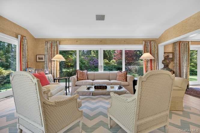 Sunny Living room with views of the beautiful gardens.