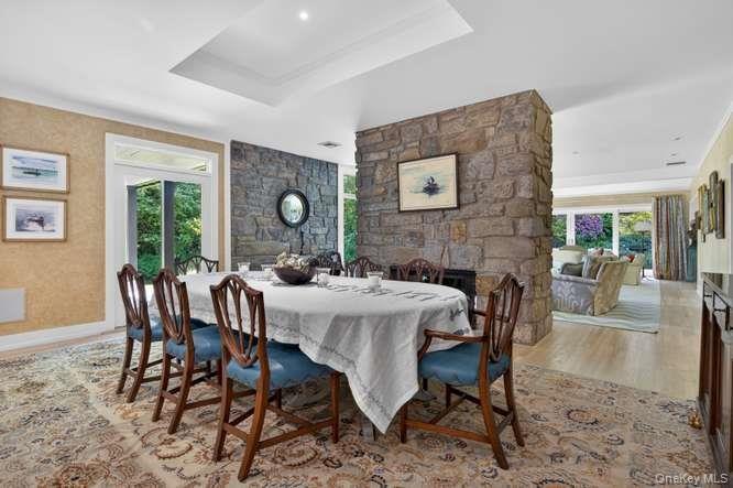 Formal dining room with wood burning fireplace.