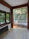 Sunroom faces bay window. Great views any time of year