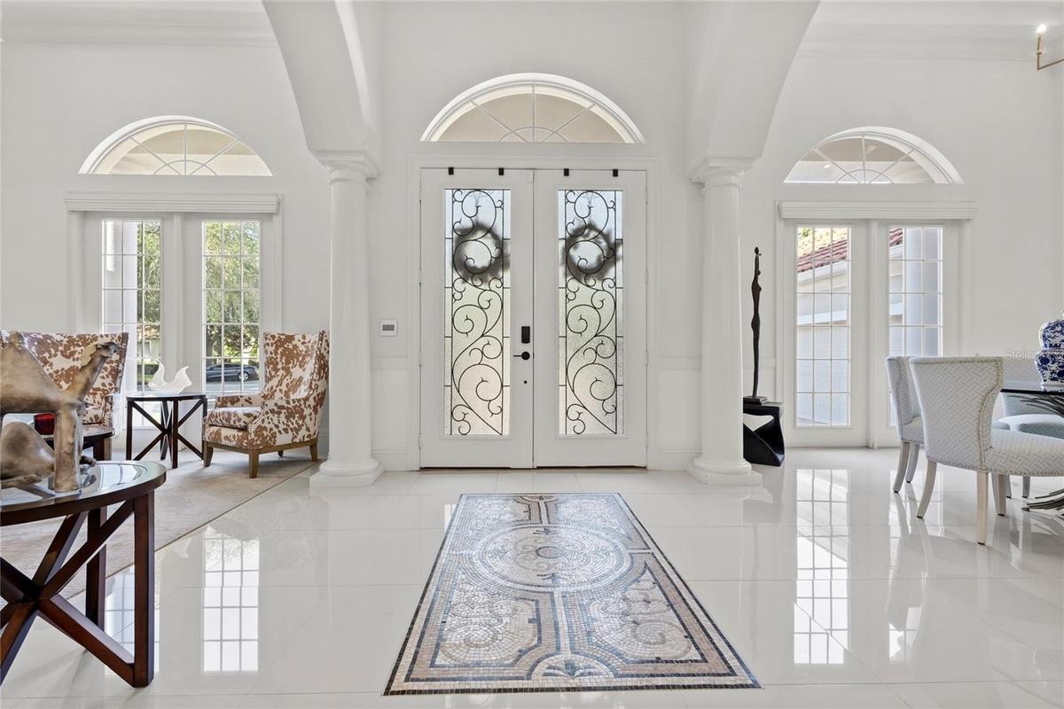 Gorgeous double door entry with custom tile inlay