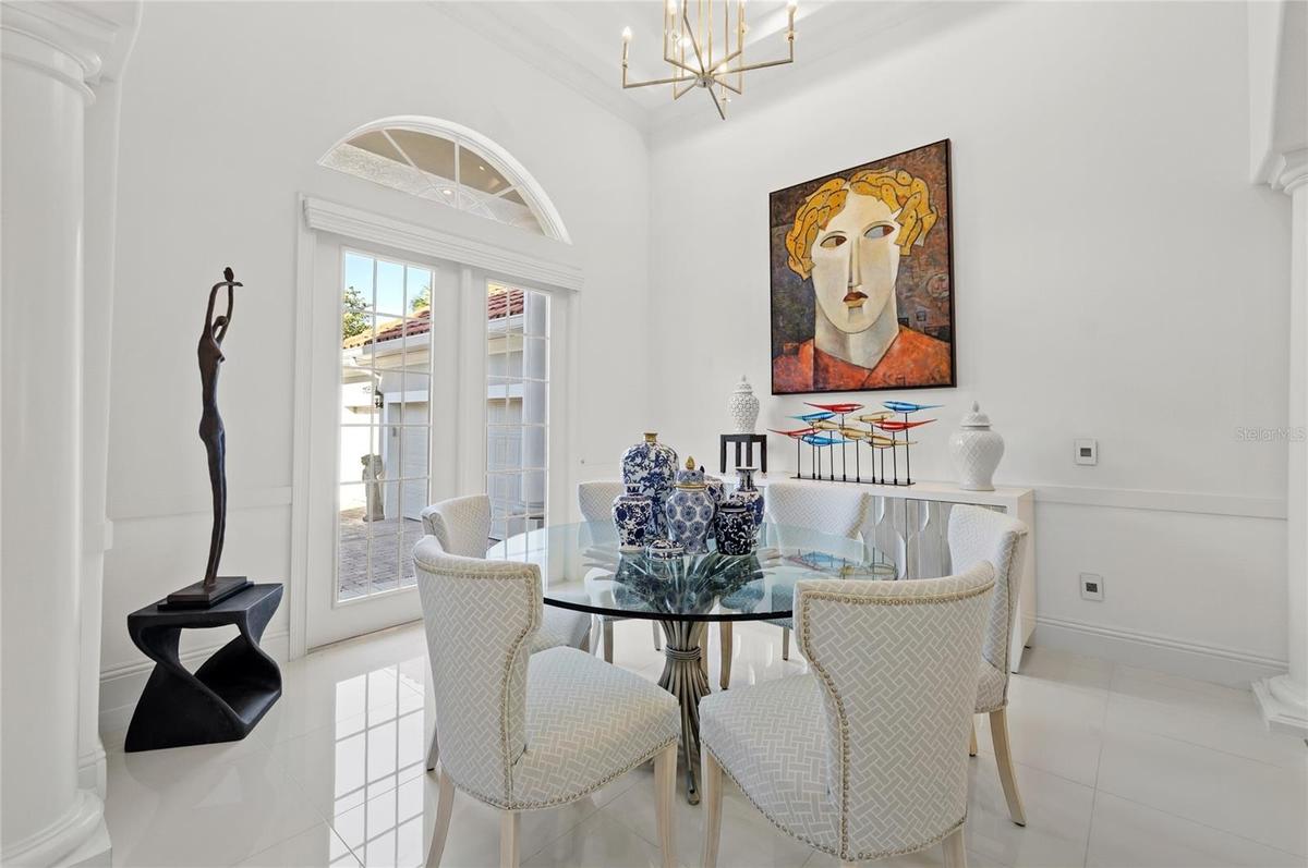 Formal dining space with abundant light. 1st hall leads to Beds 3 & 4, laundry and 3 car garage access