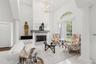 Formal living space with gas fireplace. Access to hall bath and Bed 5 with en suite