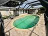 Screened lanai and built in pool.
