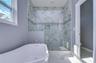 Primary bath w/ similar finishes