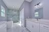 Primary bath w/ similar finishes