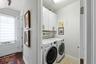 The separate laundry room with plenty of storage and space