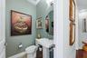 The half bath, or guest bathroom, off the foyer downstairs.