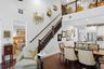 The primary suite is on the main floor, at the foot of the stairs
