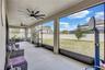Oversized screened-in patio offering a seamless extension of indoor living, ideal for relaxing or entertaining.