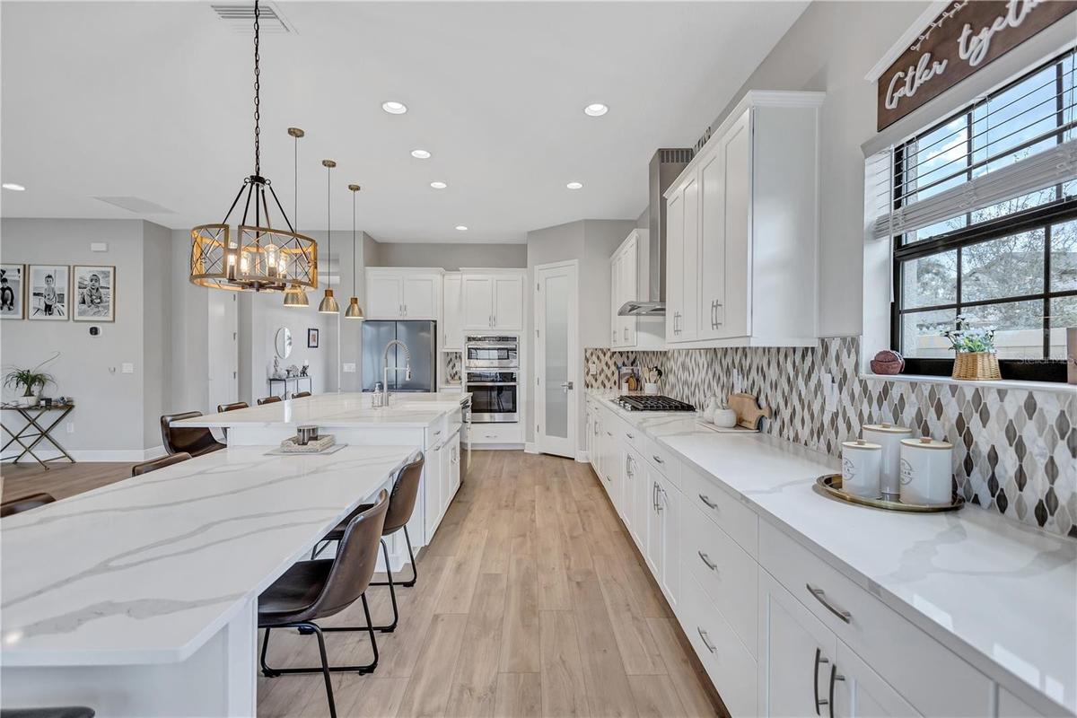 Sonoma Linen cabinets, Calacatta Novello Quartz counter-tops, Floorte Pride Plus Riverside LVP